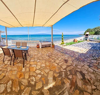 A panoramic view over the sitting area and the Aegean in front