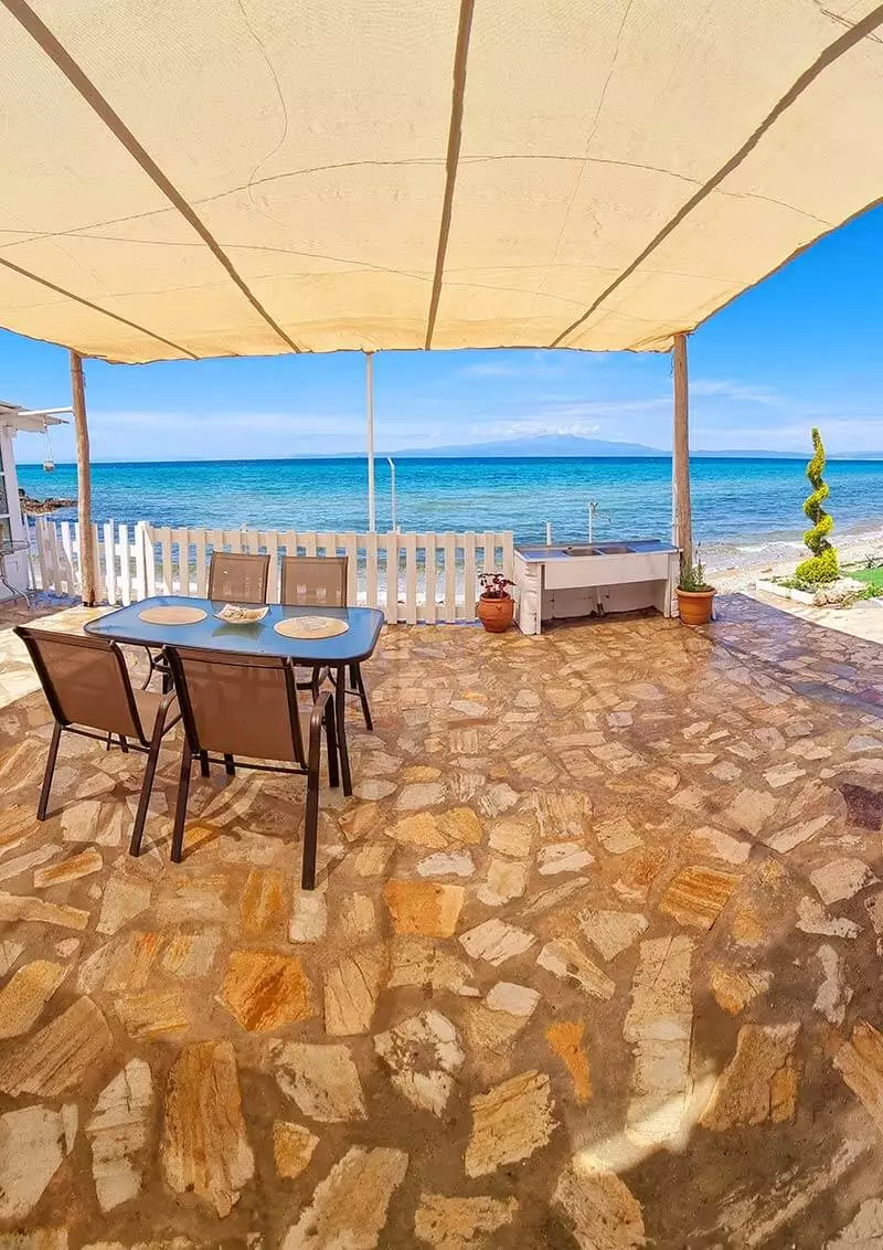 A panoramic view over the sitting area and the Aegean in front